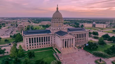 Aerial view of Oklahoma state capitol building at golden hour.