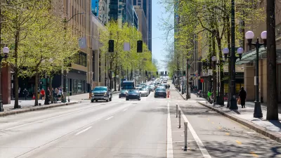 Street view of 4th Avenue, a commercial street of shops and restaurants through the city center of downtown Seattle, Washington.