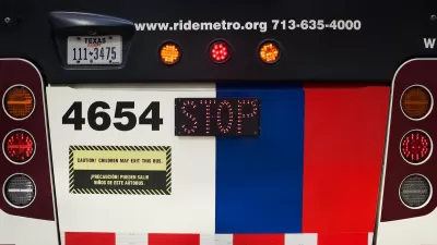 Close-up on rear of Houston Metro bus with license plate and bus number.