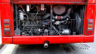 A view of the mechanics of the engine at the back of a public bus.