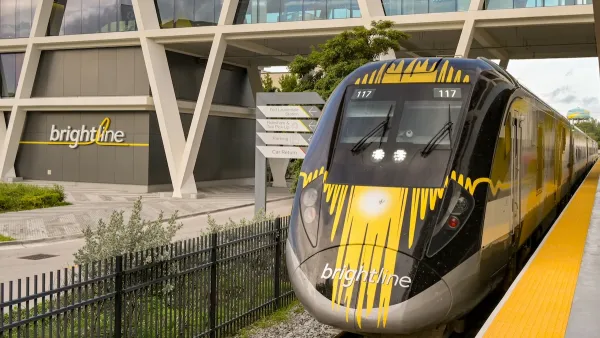 A yellow and black Birghtline high-speed rail train at station in Ft. Lauderdale, Florida.