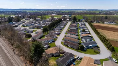 Aerial view of manufactured housing mobile home park in rural area.