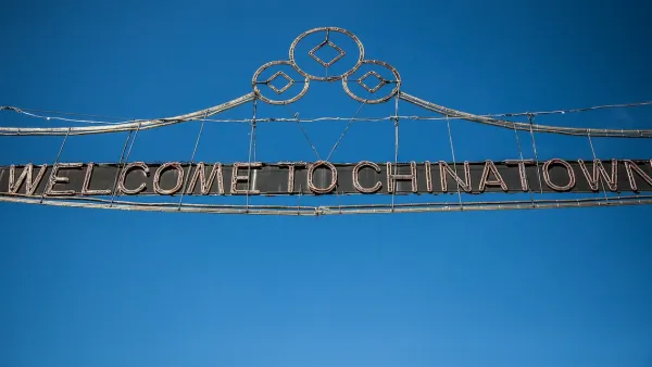 Wire sign over street "Welcome to Chinatown" in New York City.