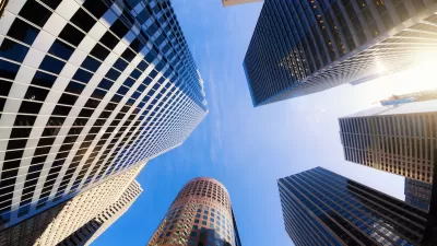Looking up at cluster of high-rise modern office buildings in San Francisco, California.