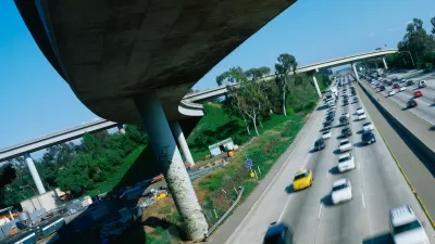 View from under tall freeway overpass in Los Angeles at intersection of I-405 and I-10.
