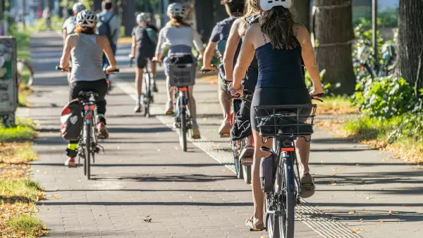 People riding bicycles on separated bike trail.