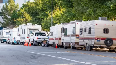 Row of RVs parked on street in Mountain View, California.
