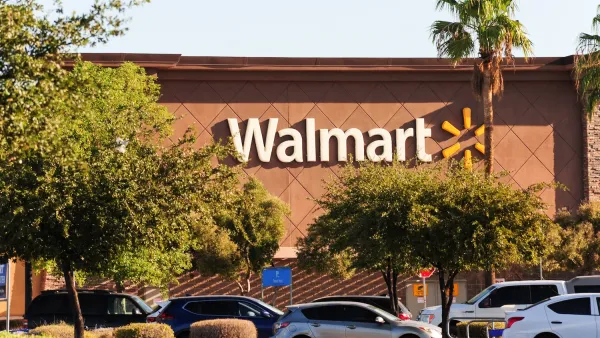 Front of Walmart store with sign.