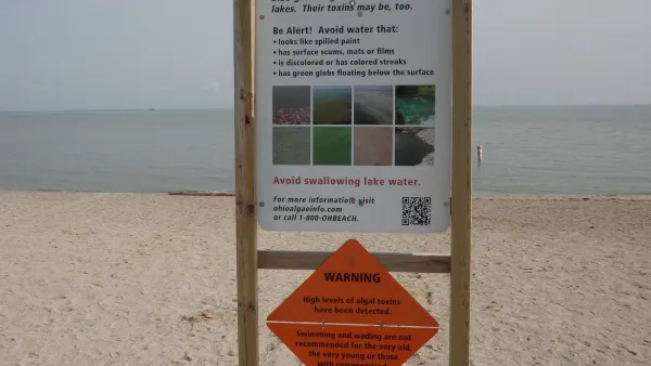 Sign warning of toxic algae bloom at Lake Erie beach in Ohio.