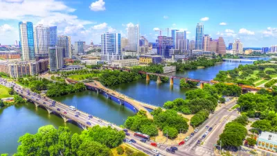 Multiple bridges busy with cars cross Lady Bird Lake outside downtown Austin, Texas.