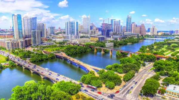 Multiple bridges busy with cars cross Lady Bird Lake outside downtown Austin, Texas.