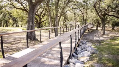 Wooden walkway in forest in Bonnet Springs Park, Lakeland, Florida.