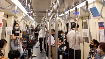 Subway riders in Bangkok wear masks during the pandemic.