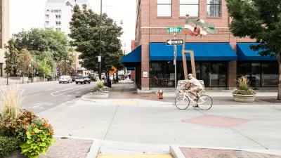 A man on a bike prepares to turn off a one way street onto a bike lane in Downtown Boise, Idaho.