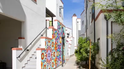 Colorful two-story buildings close to each other in Culdesac Tempe development.