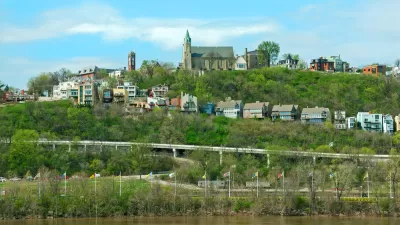 Holy Cross Immaculata Church sits atop Mt Adams in Cincinnati, as seen from across the Ohio River in Kentucky.