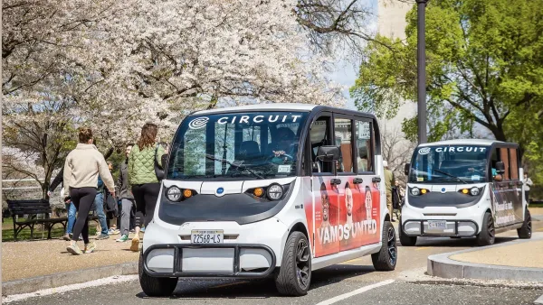 Two Circuit rideshare microbuses in Washington DC.