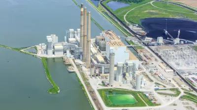 An image of a coal powered energy production facility along an unidentified waterway in Illinois.