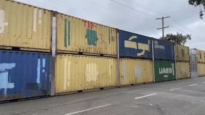 Two-level stack of shipping containers blocking off People's Park in Berkeley, California.
