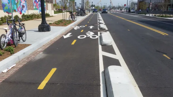Bike lane in Washington D.C. protected by low concrete barriers.