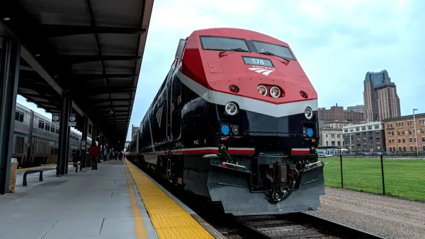 Close-up of red Amtrak Borealis train at station.