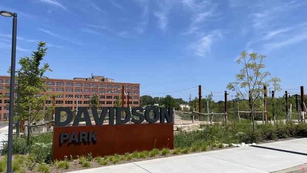 Entrance sign for Davidson Park next to Harley-Davidson HQ building in Milwaukee, Wisconsin.