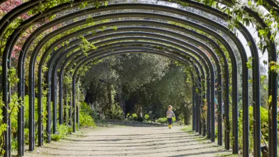 A little girl running in the beautiful Descanso Garden in Los Angeles, California.