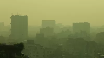 Air pollution is visible in the air around high-rise buildings in Dhaka, Bangladesh.