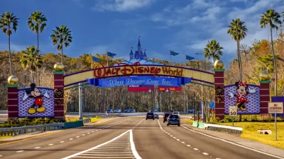 A view of the entrance to Walt Disney World reads “Where Dreams Come True.”