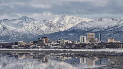 Downtown Anchorage with the snow covered Chugach Mountains in the background.