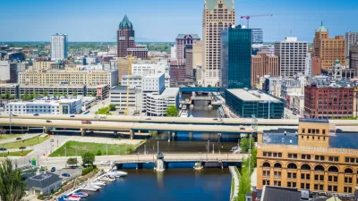 A photo of the downtown skyline in Milwaukee, along the Milwaukee RIver.