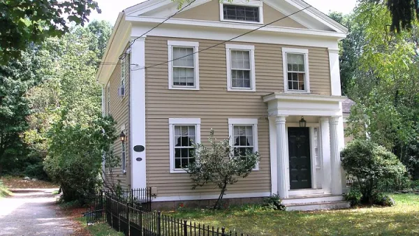 Tan historic home in Woodbridge, Connecticut.