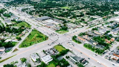 A sprawling view of Miami’s low-density residential areas, bisected by wide surface streets.