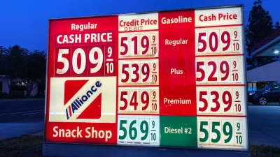 A sign showing gas prices, all at more than $5 a gallon.