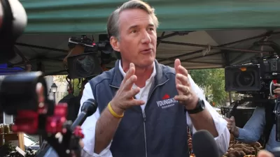 Glenn Youngkin gesturing with his hands while speaking to the media and the public while campaigning for governor of Virginia at the Alexandria Farmers Market.