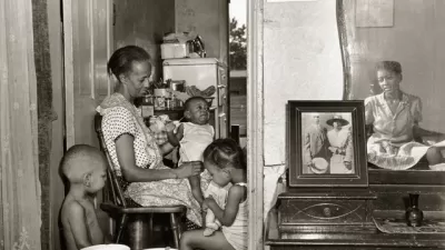 Mrs. Ella Watson, a government charwoman, with three grandchildren and her adopted daughter