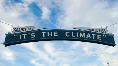 "It's The Climate" sign over street in Grants Pass, Oregon.