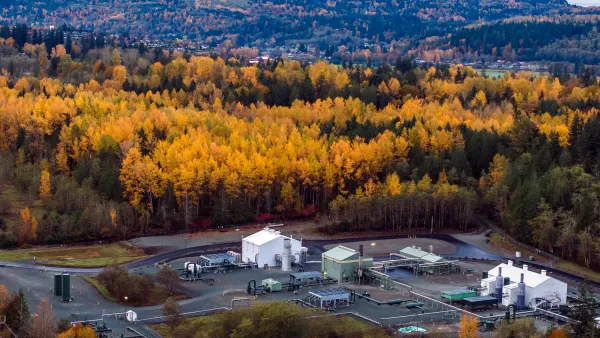 A hub for the NW pipeline, in front of a massive forest with the leaves on the trees turning orange.