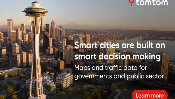 A TomTom advertisement over an image of Seattle's space needle at golden hour