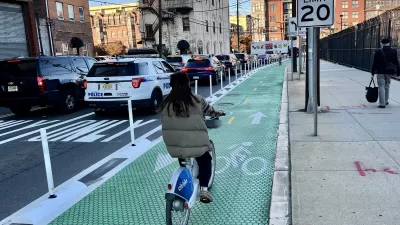 Green bike lane with flexible delineators and textures paint in Hoboken, New Jersey