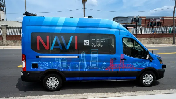 Blue self-driving Ford Transit van shuttle in Jacksonville, Florida.