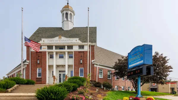 Red brick building with white columns in front for town hall in Rhode Island.