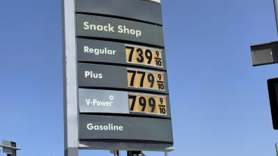 A sign with gas prices all listed above $7.39 per gallon.