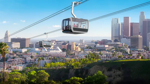Rendering of aerial gondola in air above Los Angeles with City Hall building and downtown skyline visible in background.