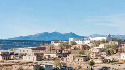The Laguna Pueblo, a Native American reservation near Albuquerque, New Mexico, is perched on a hill in the sun.