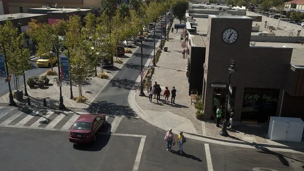 Lancaster Boulevard with tree-lined median and wide sidewalks in Lancaster, California.