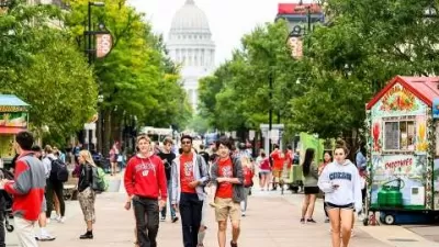 University of Wisconsin Madison students walking down LIbrary Mall pedestrian area in Madison, WI