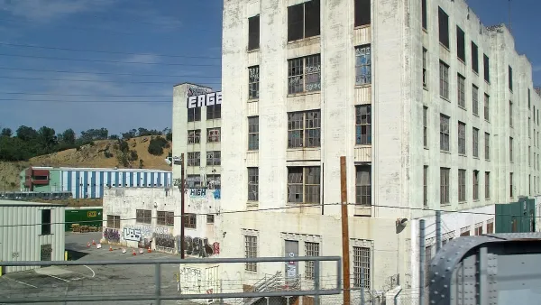 Former Lincoln Heights jail, now abandoned, with graffiti on white Art Deco stone walls in Los Angeles, California.