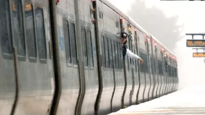 A train conductor waves at an empty platform on the Long island Rail Road system.