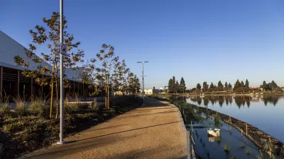 Gravel walkway along lake at Earvin Magic Johnson Park in Los Angeles County.